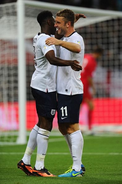 Daniel Welbeck of England (L) celebrates with team-mate Rickie Lambert of England after he scores their fourth goal during the FIFA 2014 World Cup Qualifying Group H match between England and Moldova at Wembley Stadium on September 6, 2013 in London, England. (Getty Images)